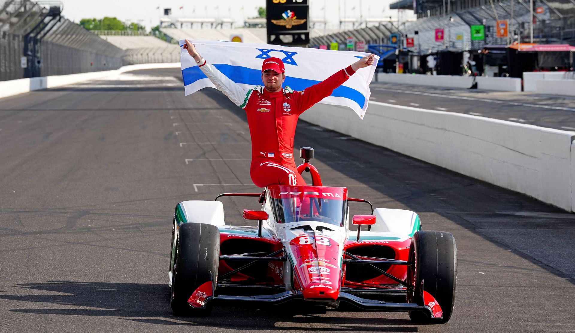 Robert Shwartzman poses with the Israeli flag after claiming pole for the 2025 Indy 500 - Source: Getty
